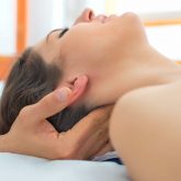 Therapist massaging the neck